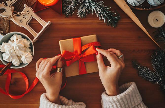 woman wrapping Christmas presents
