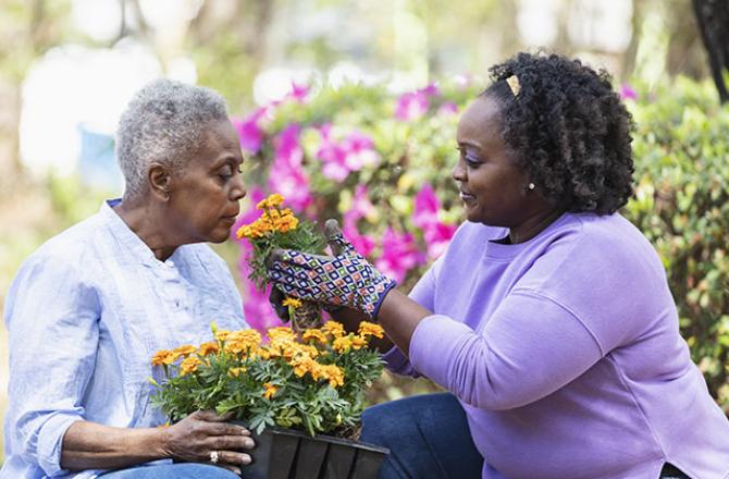 two women gardening outdoors