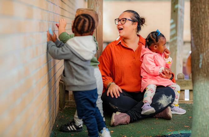 child care worker with children