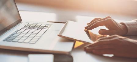 hands typing on keyboard