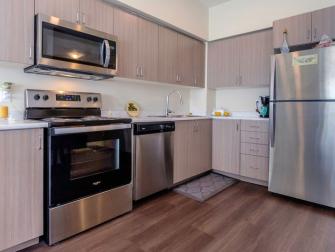 Stainless steel appliances in unit kitchens.