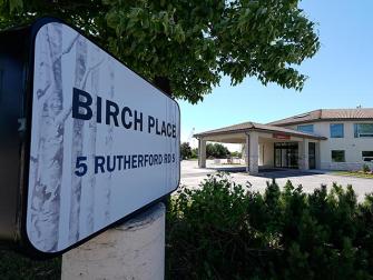 birch place sign and outside building