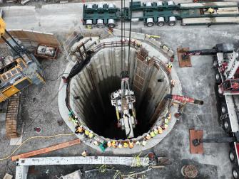 Tunnel boring machine being lowered