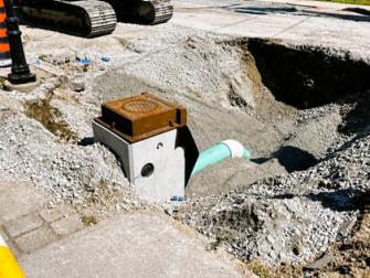 Installing catchbasins and lead connection to storm main on Airport Road.