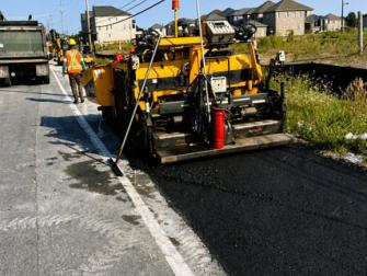 Temporary asphalt works to support future traffic staging.