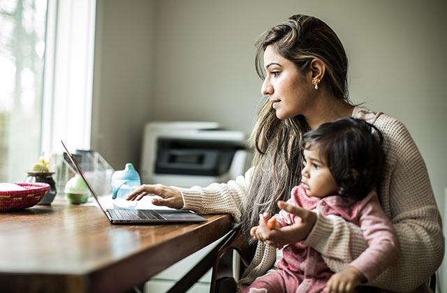 mother and daughter sitting at a desk