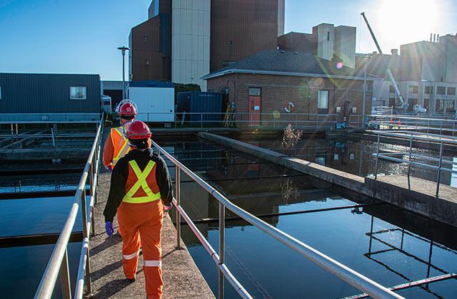 employees walking in a water-wastewater plant
